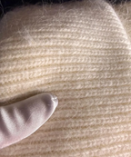 Close-up of beige angora wool hat