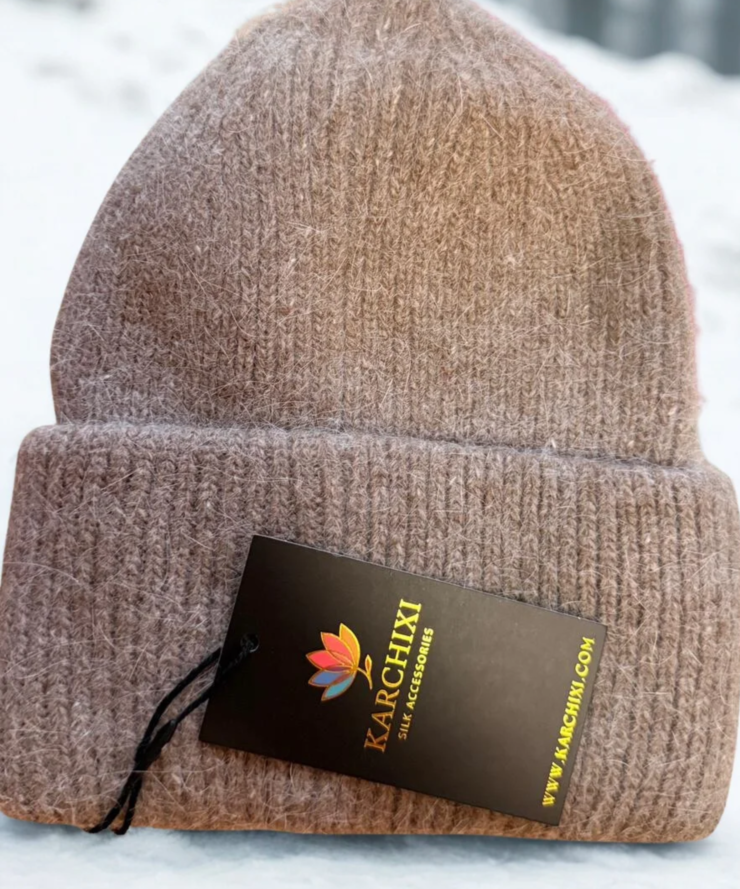 Brown knit beanie with a Karchixi tag.
